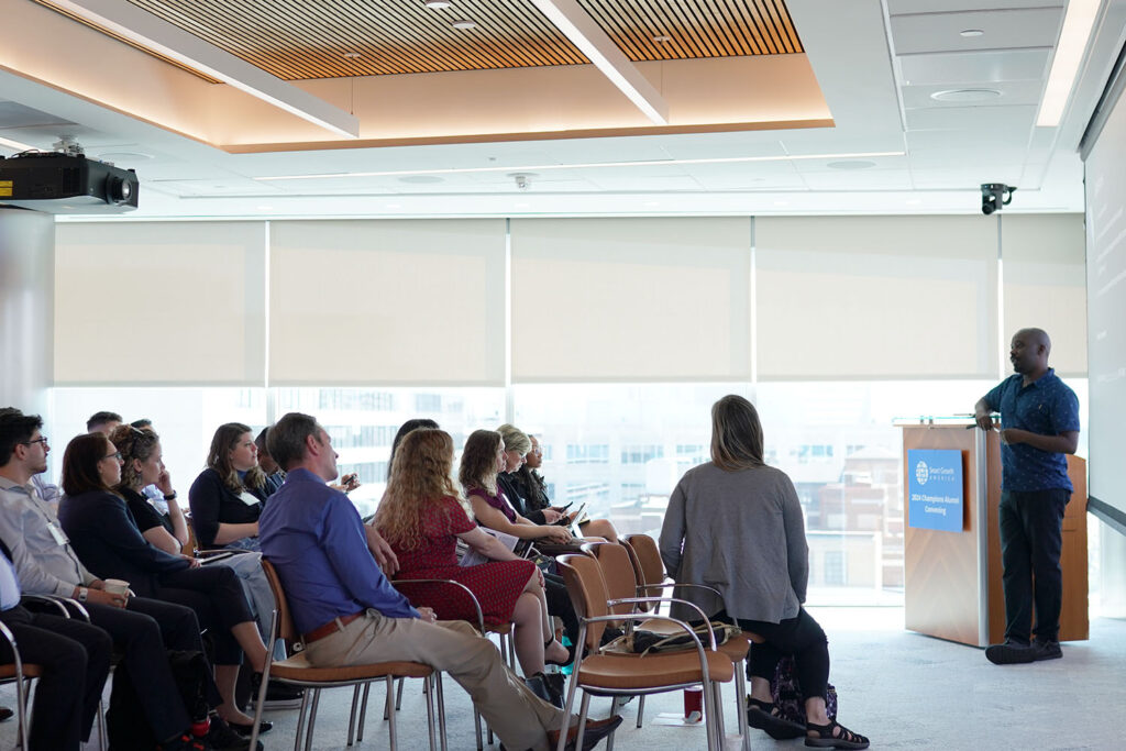 people listening to a speaker