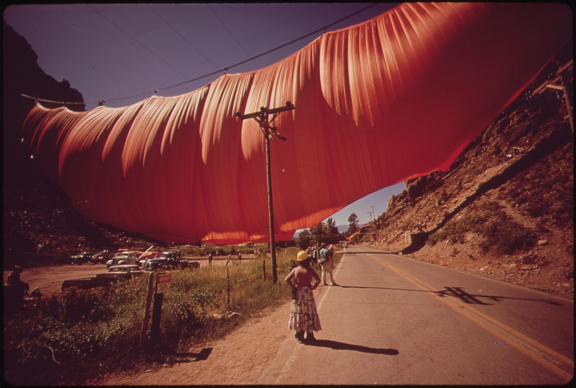 Christo and Jeanne-Claude's "Valley Curtain" swells with wind in Rifle Gap State Park in 1972, just outside of Rifle, CO. The curtain hung for 28 hours before succumbing to a gale wind. 