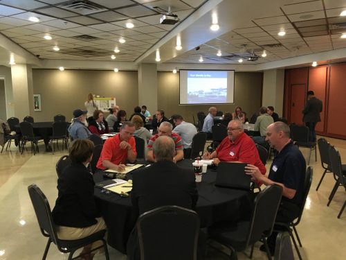 Elected officials, city leaders, and residents work in breakout sessions at an SGA workshop in October.