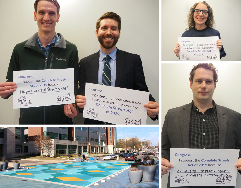 various attendees of the roundtable holding signs supporting the Complete Streets Act