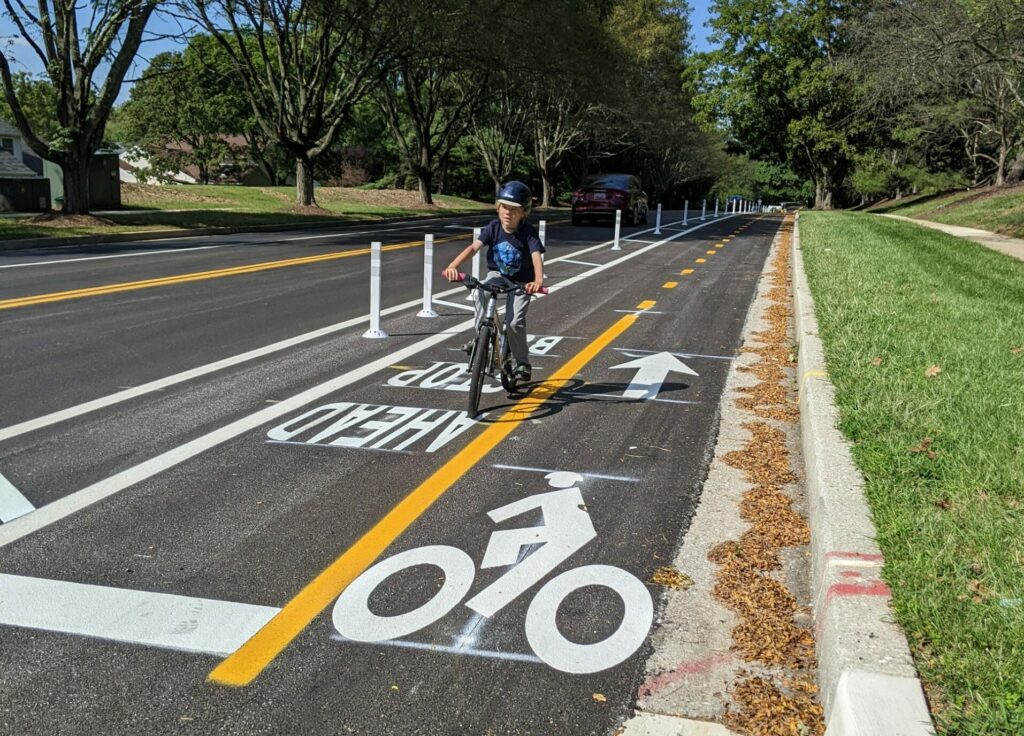 A bicyclist on the Oakland Mill Road cycletrack