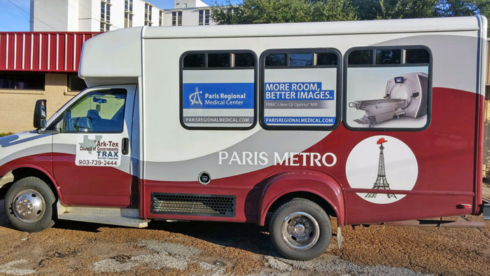 A red and white Paris Metro minibus