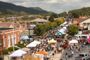 A street filled with people attending the Unicoi County Apple Festival in Erwin Tennessee