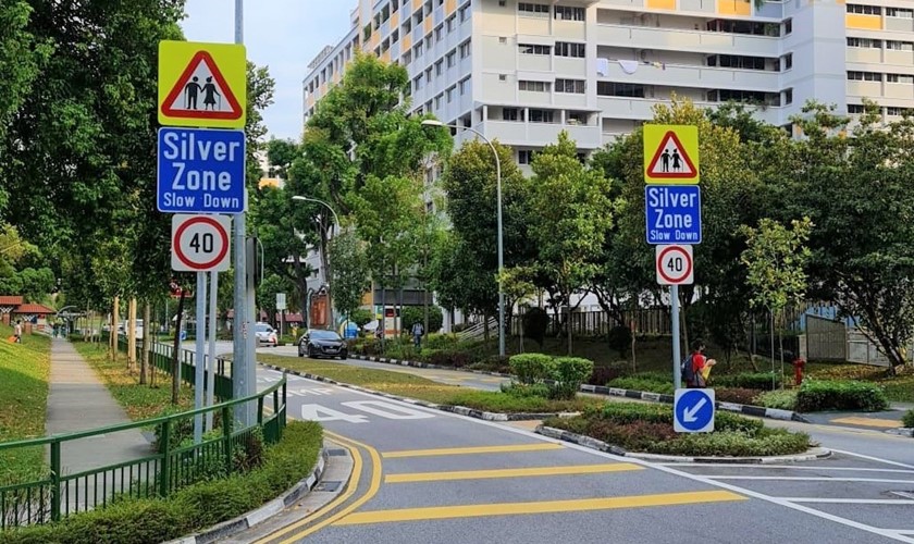 Signs on the road reduce speed limit to indicate a silver zone in Singapore 