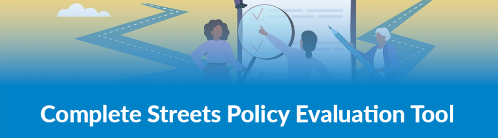 Stylized graphic showing animated people looking at a clipboard with a road extending in the background. Includes text that says "Complete Streets Policy Evaluation Tool"