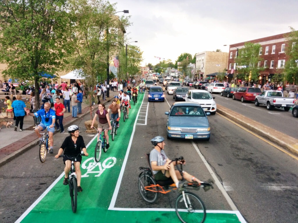 Bikers use a green painted bike lane on a Complete Street in Akron, Ohio. 
