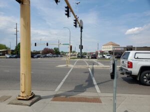 Another view of the crosswalk, showing that it is broken up by a median to shorten the distance pedestrians need to cross.