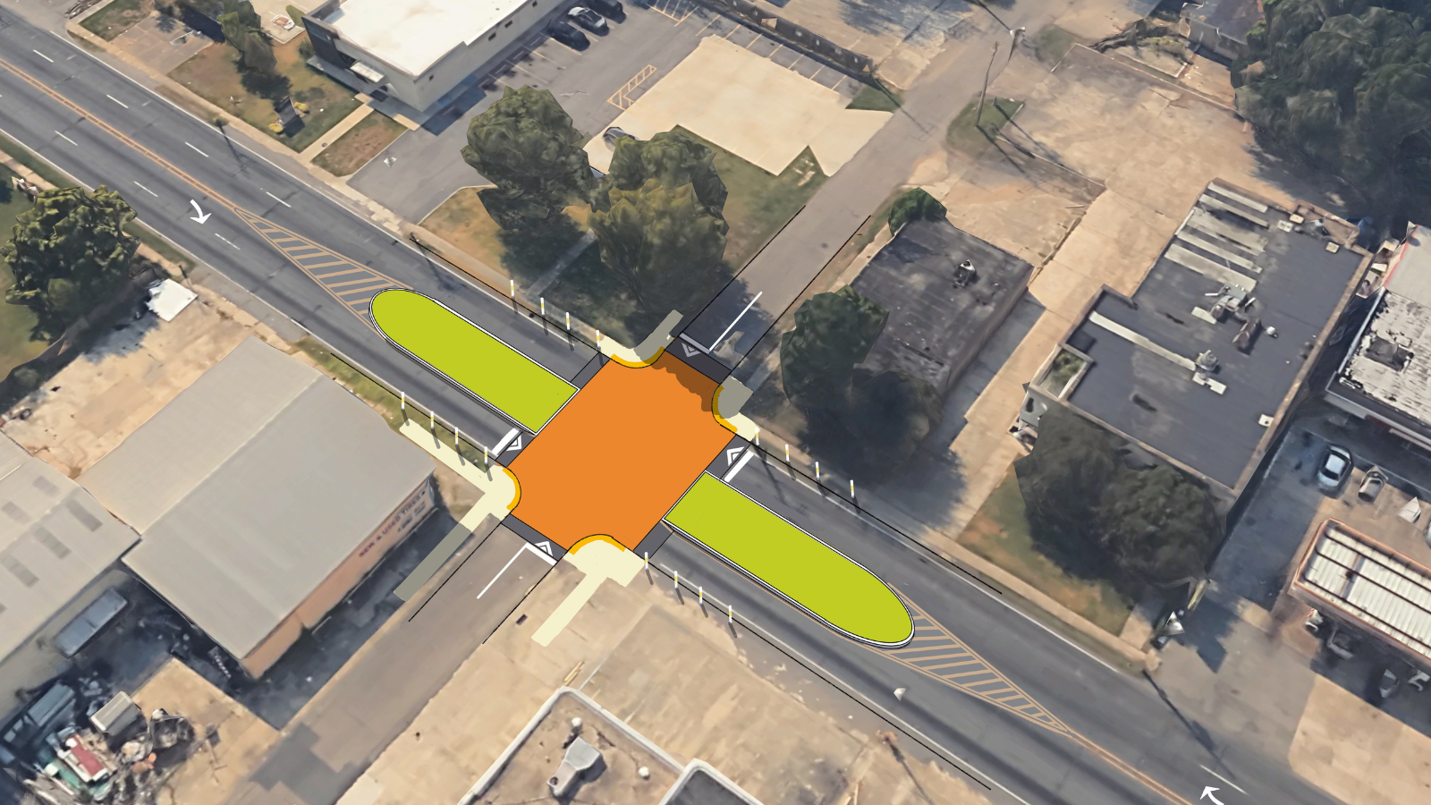 The four-lane road is reduced to single lanes of travel in both directions, plus a wide median and massive crosswalk enhance pedestrian comfort as they cross