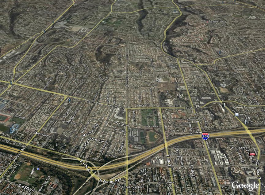 Google Earth screenshot shows a more recent picture of National City, with large roadways highlighted in yellow lacing through the city's core