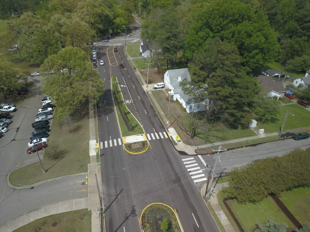 Crosswalks and a wide median help to reclaim space for people crossing a wide roadway