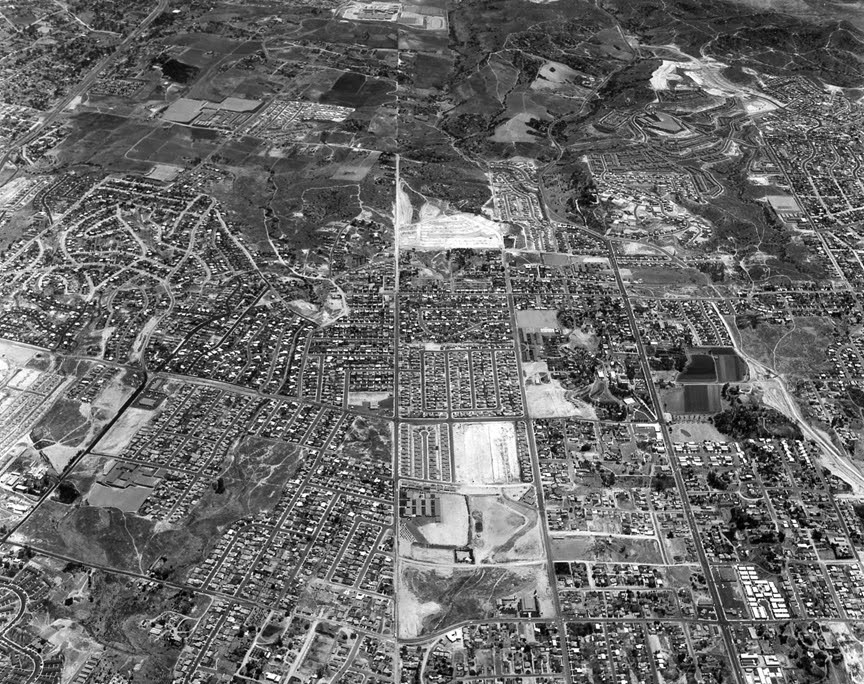A black and white aerial photo shows the relatively dense community of National City before the highway boom.