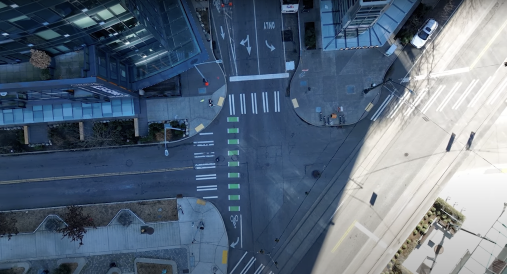Aerial shot of intersections in Washington State, with pedestrians walking on sidewalks