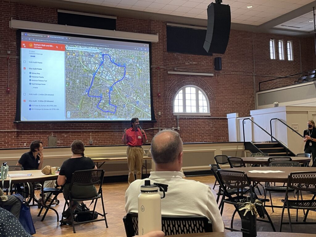 Smart Growth America employee Jaibin Mathew delivers a presentation to Durham, NC stakeholders