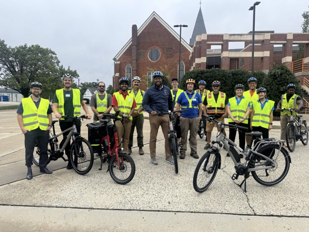 Bike audit participants line up for a group photo in downtown Durham